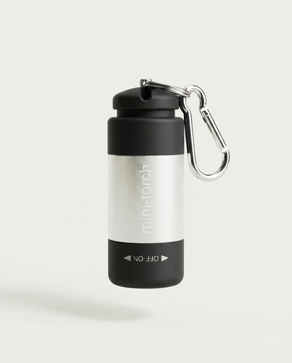 Mini Torche argent — bandeau métallique brossé sur corps noir