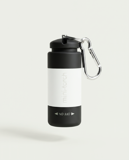 Mini Torche blanche — bandeau blanc sur corps noir, prise USB intégrée